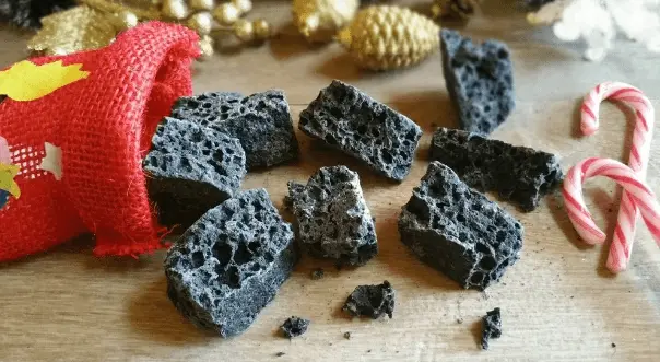 Image Befana stocking with little chunks of coal